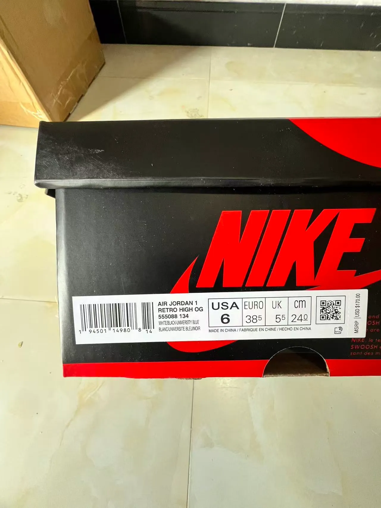 Chaussures de basketball montantes Air Jordan 1 à empiècements en daim et cuir bleu et blanc 10