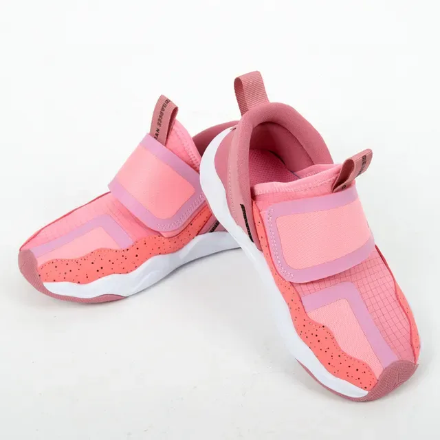 Sneakers lifestyle sans lacets Air Jordan à semelle intermédiaire ondulée orange et noir 12
