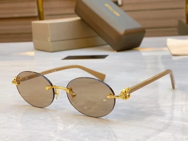 Bvlgari Óculos de sol marrom dourado sem aro oval carey hastes 6