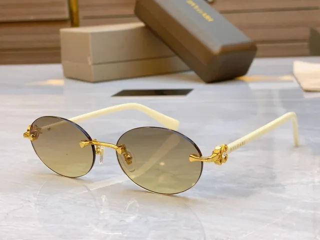 Bvlgari Óculos de sol marrom dourado sem aro oval carey hastes 7