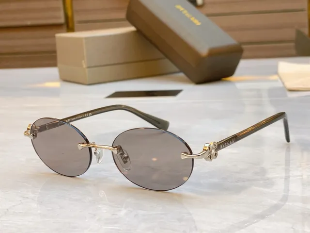 Bvlgari Óculos de sol marrom dourado sem aro oval carey hastes 8