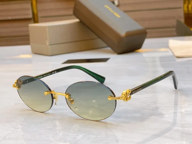 Bvlgari Óculos de sol marrom dourado sem aro oval carey hastes 9
