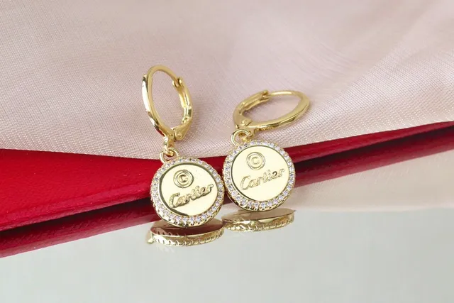 Cartier Boucles d'oreilles de disque circulaire en or et argent avec halo de cristal pavé 7