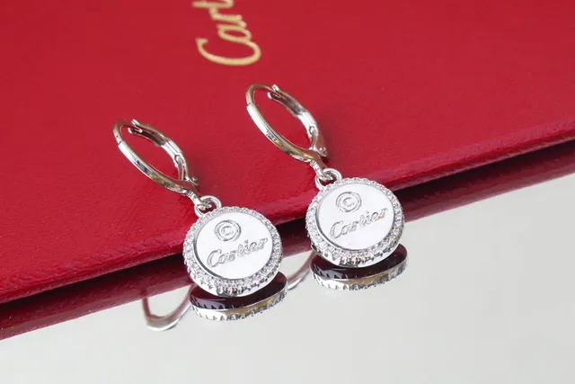 Cartier Boucles d'oreilles de disque circulaire en or et argent avec halo de cristal pavé 9