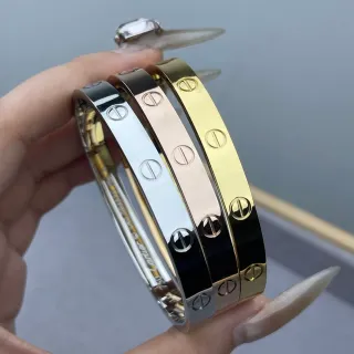 Cartier Love bangle rígido dorado negro motivo de tornillo