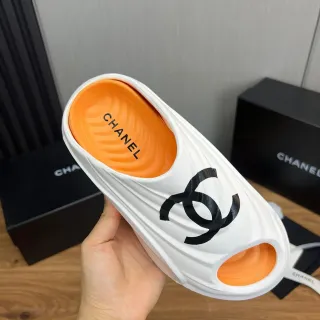 Chanel CC Slide White Orange Molded Rubber-Like Upper Interlocking Logo Slippers