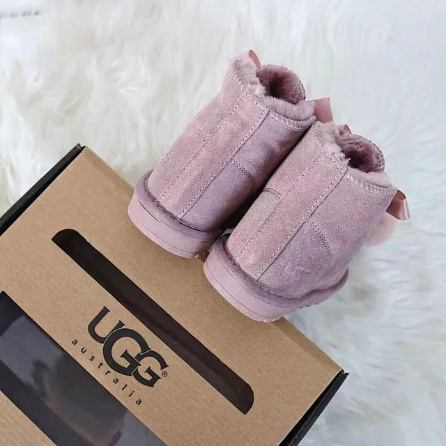 Botines de neige en fourrure avec pompon cousu en moccasin noir et rose 20