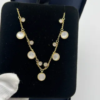 Collier perles et cristaux doré à multiples gouttes