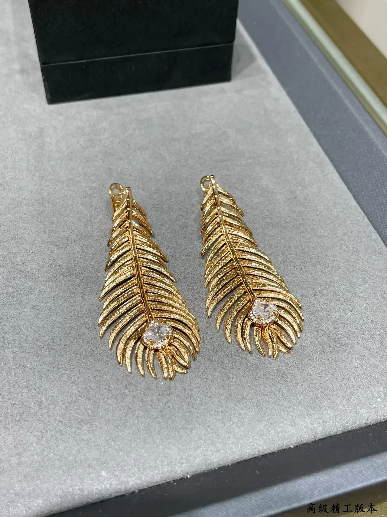 Gold Transparent Feather Motif Textured Ridged Surface Earrings 3
