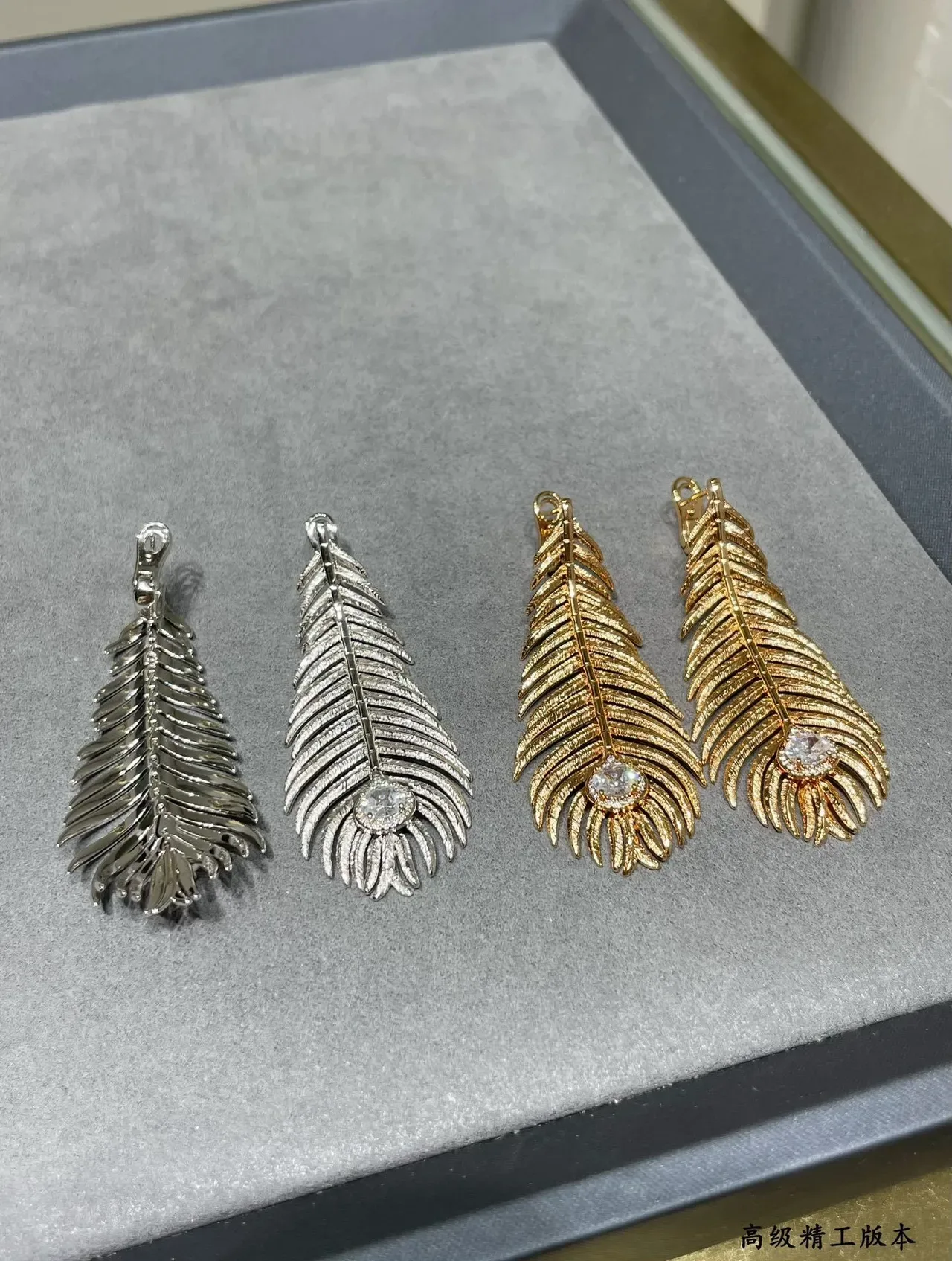 Gold Transparent Feather Motif Textured Ridged Surface Earrings 5