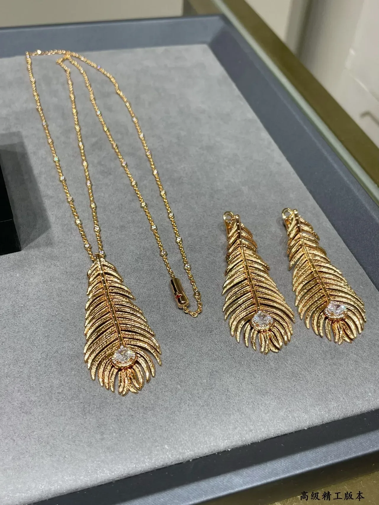 Gold Transparent Feather Motif Textured Ridged Surface Earrings 7
