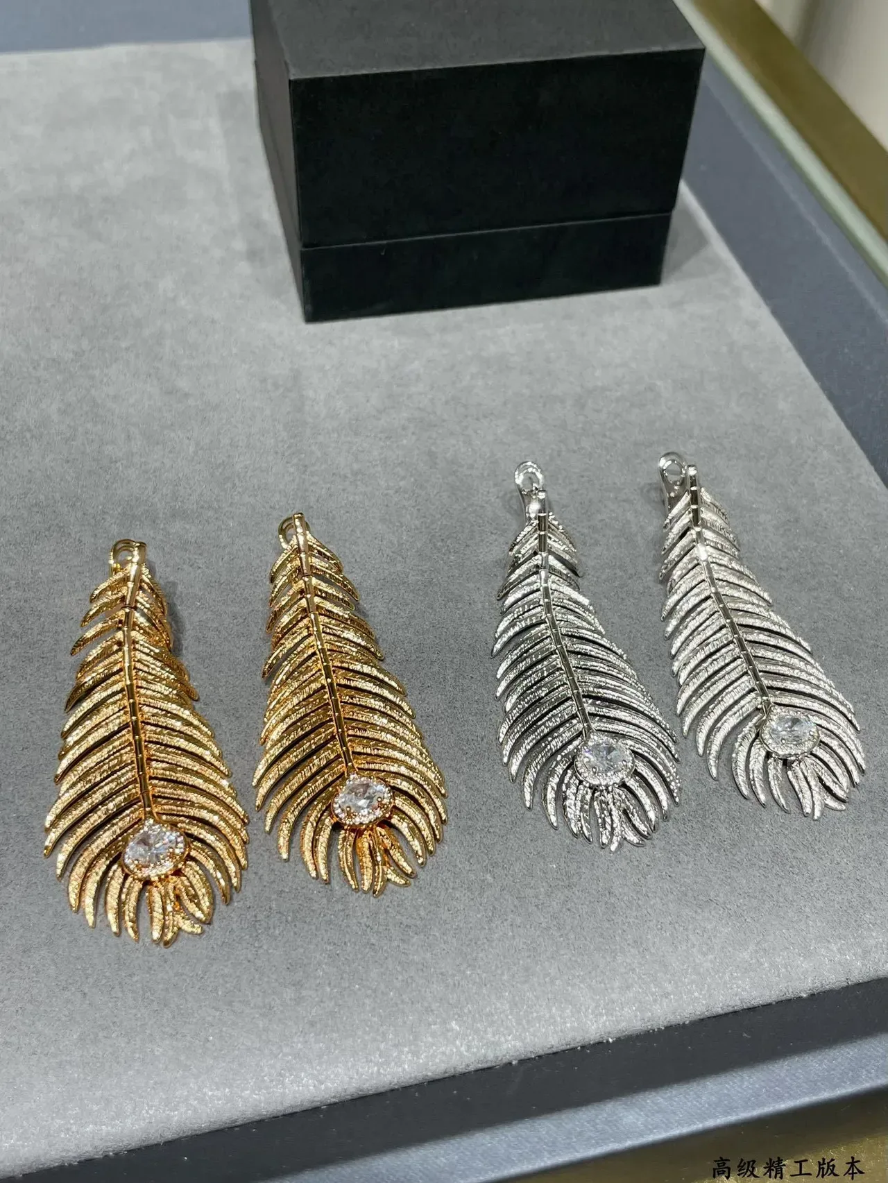 Gold Transparent Feather Motif Textured Ridged Surface Earrings 8