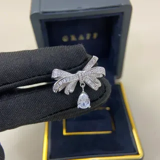 Graff Bow Pavé Baguette and Pear-Cut Drop Brooch