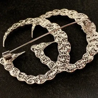 Serpentine Textured Silver-Tone Interwoven Brooch