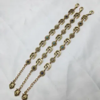 سوار Gucci ذهبي أزرق معدني Interlocking GG Links