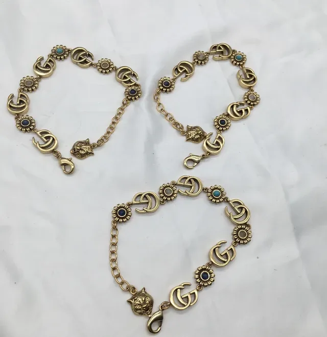 سوار Gucci ذهبي أزرق معدني Interlocking GG Links 3