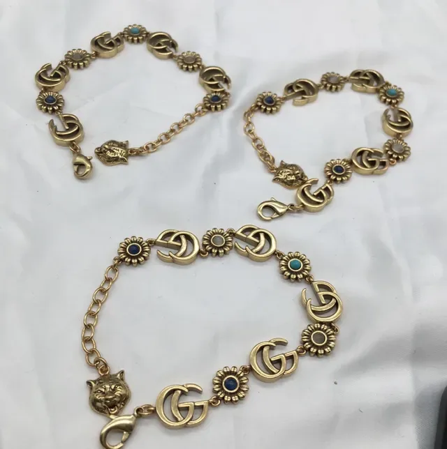 سوار Gucci ذهبي أزرق معدني Interlocking GG Links 5