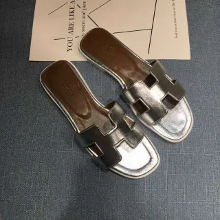 Hermès Oran H-Strap Metallic Silver and Black Slippers