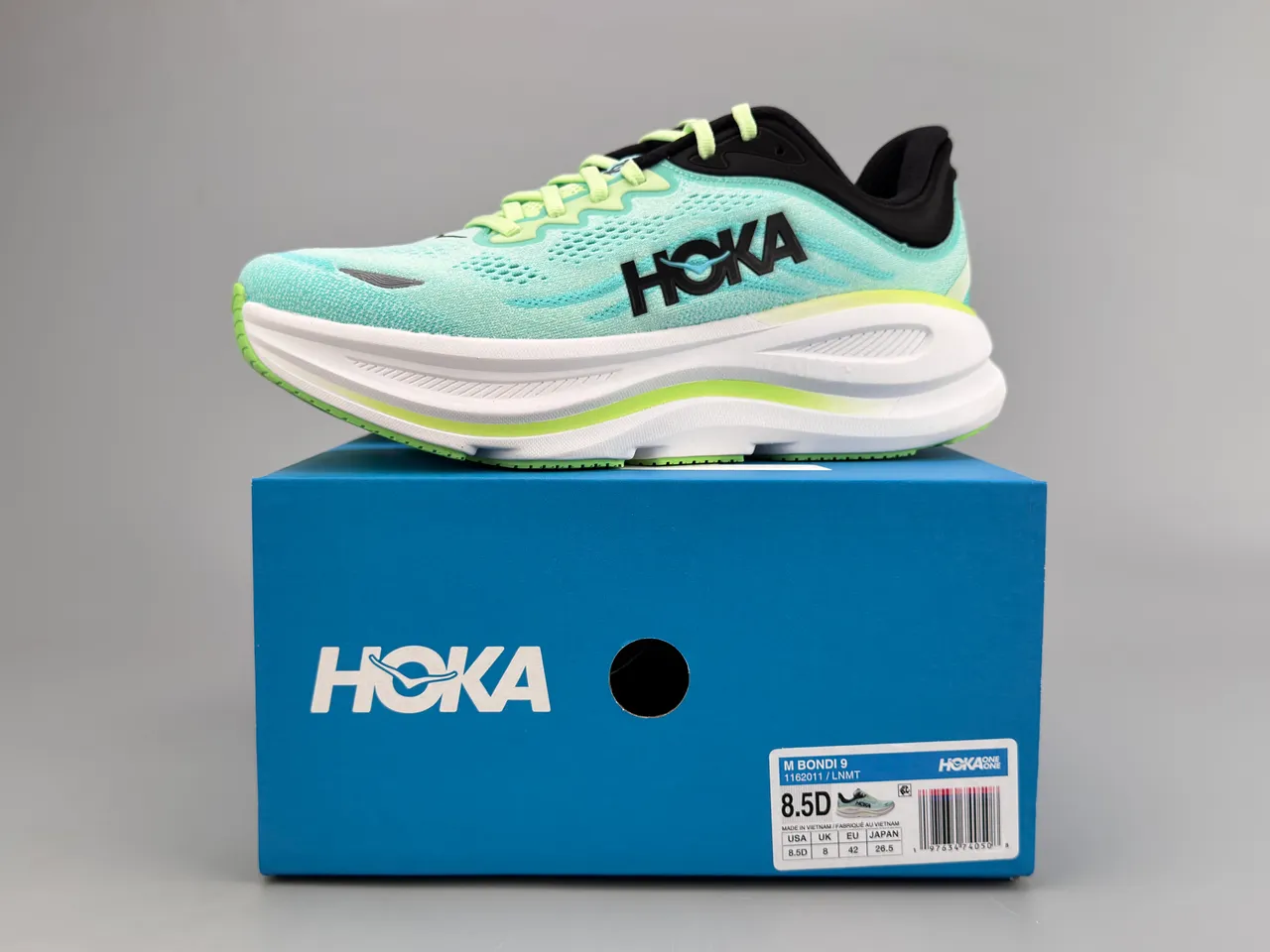 Hoka Tênis de corrida com upper de knit azul verde sola média espessa branca 4
