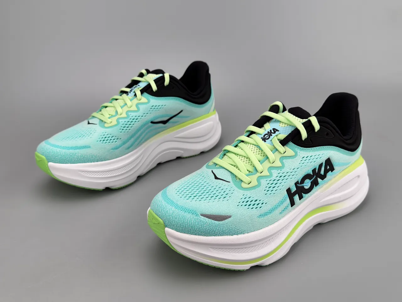 Hoka Tênis de corrida com upper de knit azul verde sola média espessa branca 6