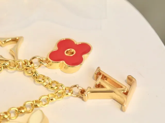 Louis Vuitton Gold Red Metal Enamel Floral Charms Bracelet 9