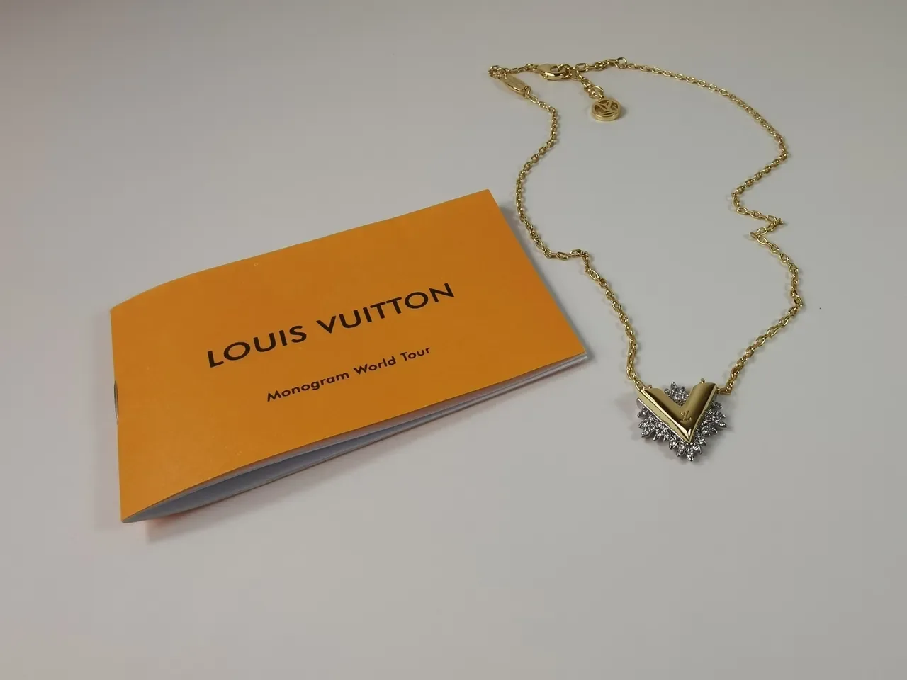 Louis Vuitton Gold-Tone Crystal V Motif Necklace 8