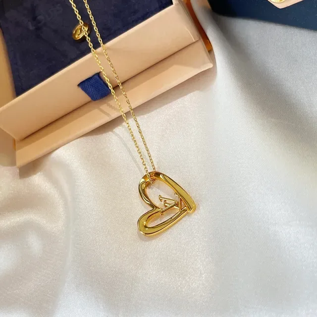 Louis Vuitton Gold-Tone Open Heart and Monogram Pendant Necklaces 7