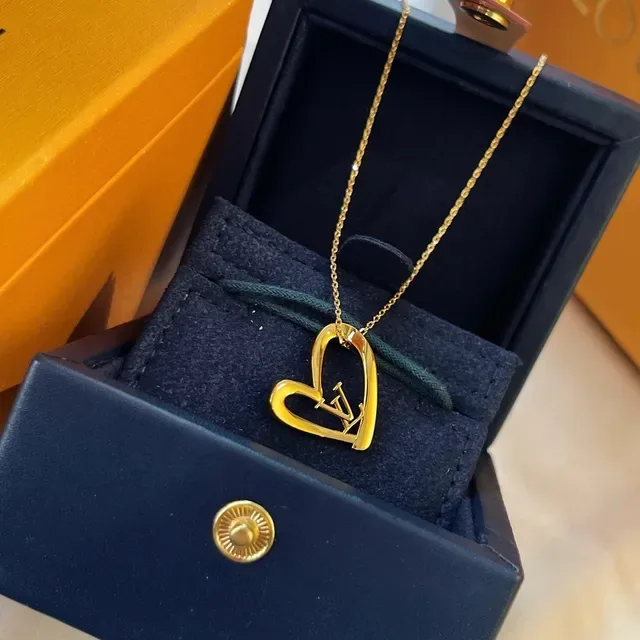 Louis Vuitton Gold-Tone Open Heart and Monogram Pendant Necklaces 8