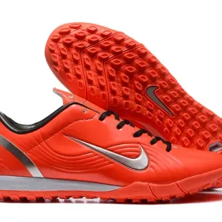 Nike Zapatos de fútbol turf naranja y negro con paneles embossados en onda y parte superior sintética