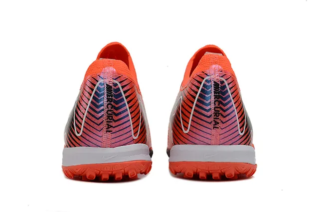 Nike Chaussures de football orange rose avec upper tricot et semelle turf 4