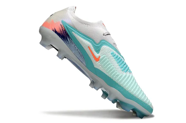 Nike Zapatos de fútbol con upper de tejido blanco y azul, bajo, estilo botín, para terreno firme 2