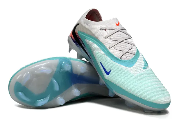 Nike Zapatos de fútbol con upper de tejido blanco y azul, bajo, estilo botín, para terreno firme 4