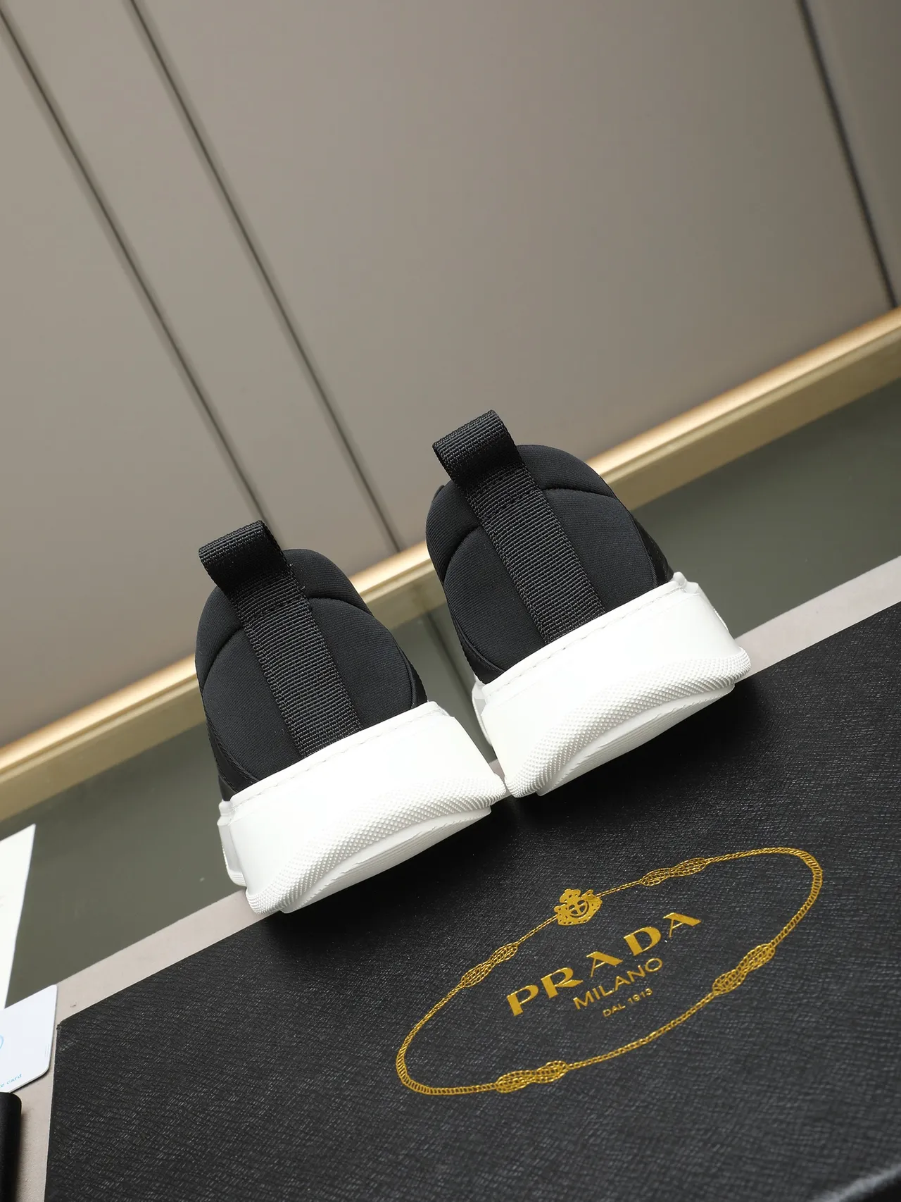 Prada Slip-On Minimalist Black and White Lifestyle Sneakers 4