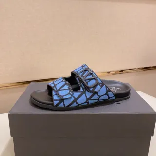 Valentino VLogo Slide Sandalias azules con impresión geométrica