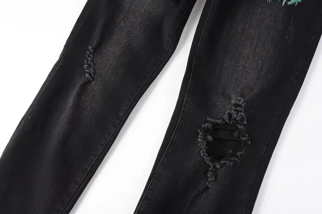 Amiri impression graphique distressed jeans en denim noir 7