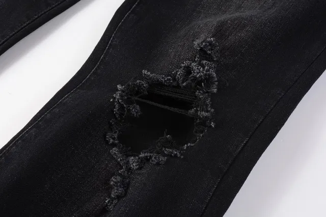 Amiri impression graphique distressed jeans en denim noir 8
