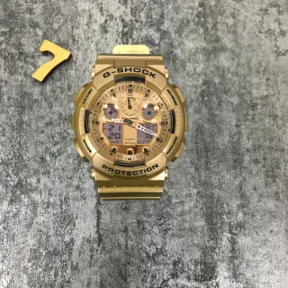 Casio G-Shock GA-100 Gold-Tone Analog-Digital Sports Watch