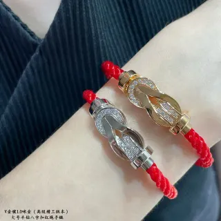 Pulsera de cordón trenzado rojo y oro con cierre de metal en forma de nudo