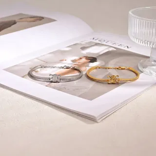 Brazaletes de cristal pavé con motivo de logo en plata y oro