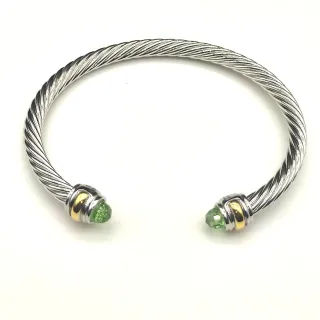 Pulsera de metal bicolor con cable trenzado de plata y oro