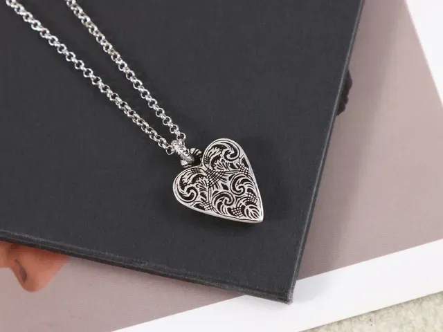 Gucci Silver Black Heart-Shaped Locket Engraved Latin Phrase Necklace 7