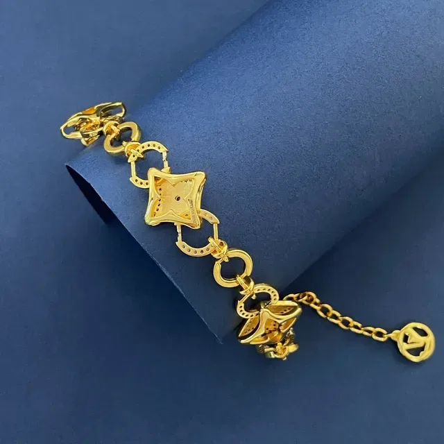 Pulsera Louis Vuitton Blossom Quatrefoil Link Oro y Negro Esmalte Cristal 6