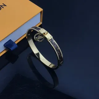 Louis Vuitton Brazalete con Bisagra Dorado Marrón con Monograma de Cuero Inlay