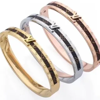 Louis Vuitton Monogram Canvas brazalete oro marrón con bisagra e incrustación