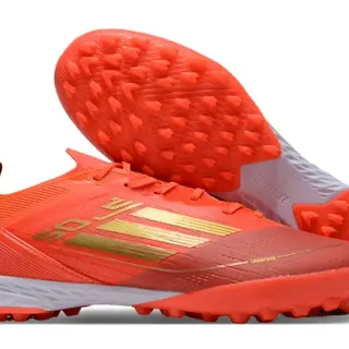 Adidas Sapatos de futebol com upper de malha, marca de listras, corte baixo, para gramado artificial, cor laranja e dourado