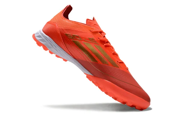 Adidas Sapatos de futebol com upper de malha, marca de listras, corte baixo, para gramado artificial, cor laranja e dourado 2