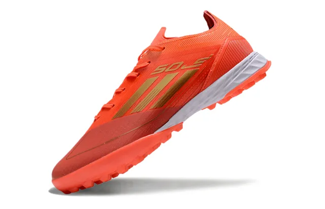 Adidas Sapatos de futebol com upper de malha, marca de listras, corte baixo, para gramado artificial, cor laranja e dourado 3