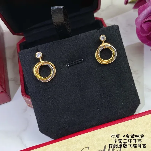 Cartier Trinity Boucles d'oreilles or et argent triple entrelacées un seul diamant 2