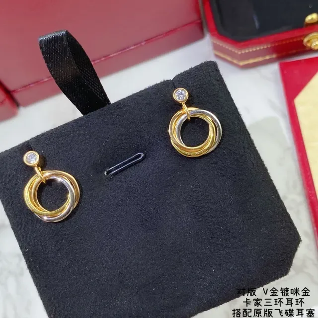 Cartier Trinity Boucles d'oreilles or et argent triple entrelacées un seul diamant 7
