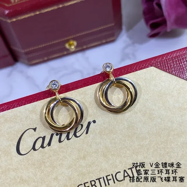 Cartier Trinity Boucles d'oreilles or et argent triple entrelacées un seul diamant 8